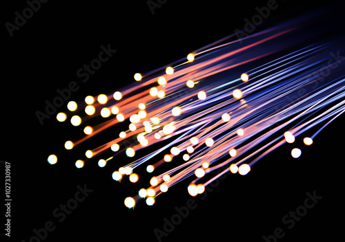 Blue and purple fiber optic cables with a glowing  light at the end.
 photo