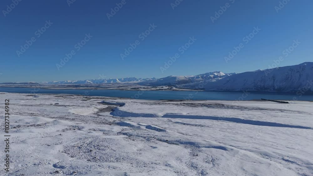 Lake Tekapo admires with beauty on cold sunny winter day Lake Tekapo admires with beauty on cold sunny winter day