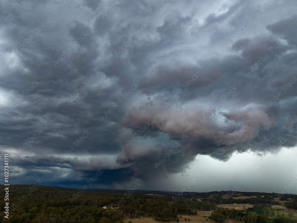 Aerial view of rain falling from a dark dramatic storm front Aerial view of rain falling from a dark dramatic storm front