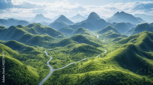 Mountains with winding roads through grassy hills, carved out of the landscape