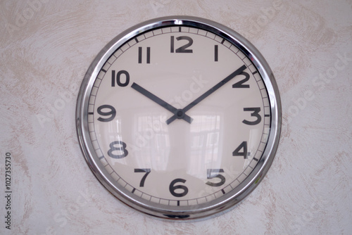 Wallpaper Mural A large round clock with a black dial on the wall. Big white wall clock with hands and numbers. Torontodigital.ca