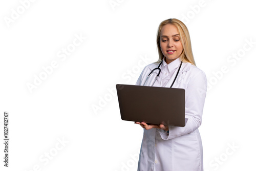 Focused young doctor using a laptop for patient care