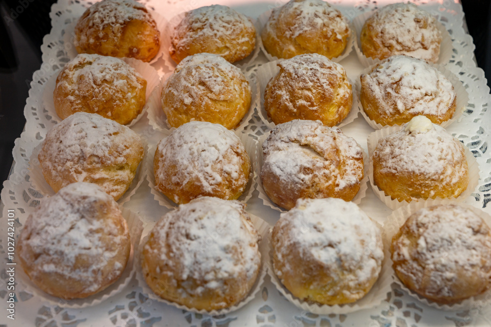 Chouquettes or petits choux are small pieces of French patisserie consisting of small spheres of choux pastry, sugared and baked, Bordeaux, France Chouquettes or petits choux are small pieces of French patisserie consisting of small spheres of choux pastry, sugared and baked, Bordeaux, France