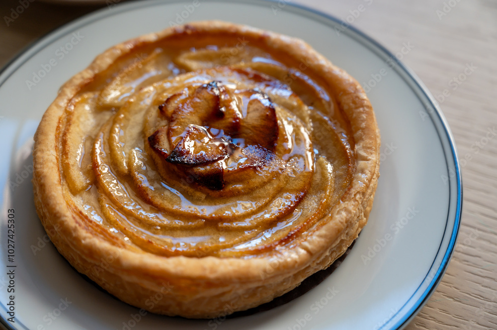 French fresh baked sweet puff pastry with fresh apple fruits in sirup in confectionery shop French fresh baked sweet puff pastry with fresh apple fruits in sirup in confectionery shop