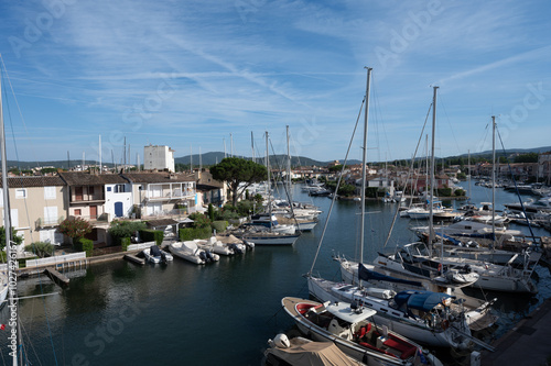 Travel and summer vacation destination, view on houses, roofs, canals and boats in Port Grimaud, Var, Provence, French Riviera, France photo