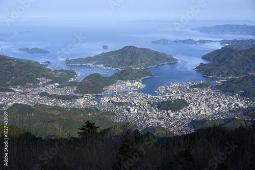 愛媛県宇和島市の市街地。宇和海にある風光明媚な島々や養殖筏、リアス式海岸のある風景。 photo