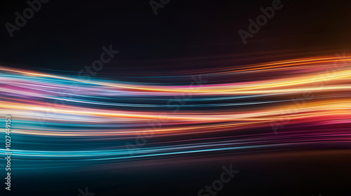 abstract background consisting of moving shining bright and neon lines, similar to traces of car headlights