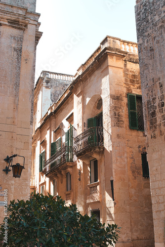 MDINA CITY, MALTA - AUGUST 05, 2021. The Silent City. This was once the Capital City of Malta. The houses are built of sandstone which is traditional for Malta. During summer on a hot sunny morning.