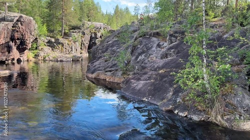 River runs over rocks in a forest