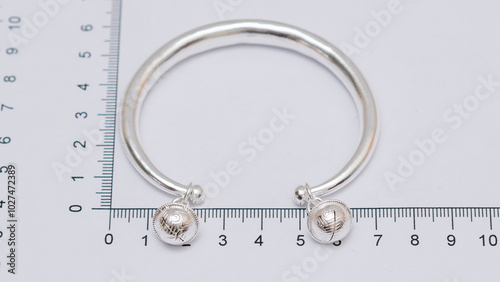 Hmong or Miao handmade silver jewelry on white background photo