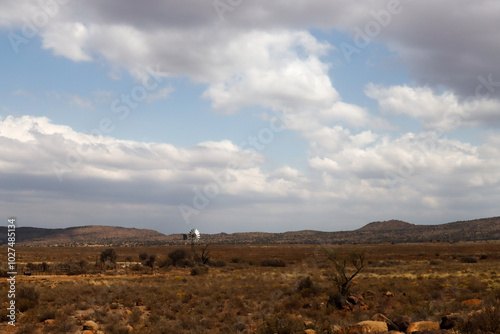 Windmill supplying water to sheep and cettle at a stock sorting point on a Karoo farm, South Africa photo