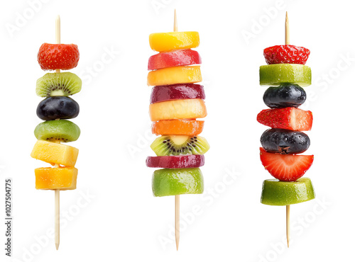 Colorful fruit skewers on wooden sticks, white isolate background.
