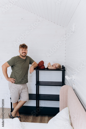  Father and son spending time together in a cozy, modern home interior with minimalist design photo