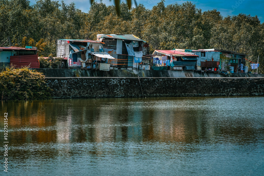 Houses and trees within a fish pond. Houses and trees within a fish pond.