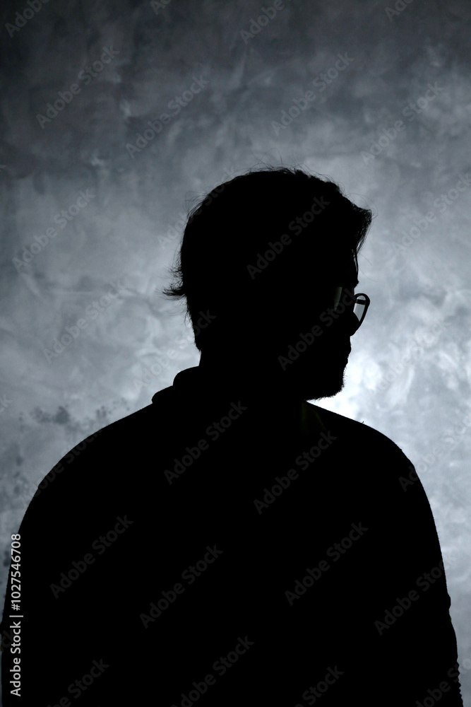 side view body silhouette portrait of a man on a dark abstract background side view body silhouette portrait of a man on a dark abstract background