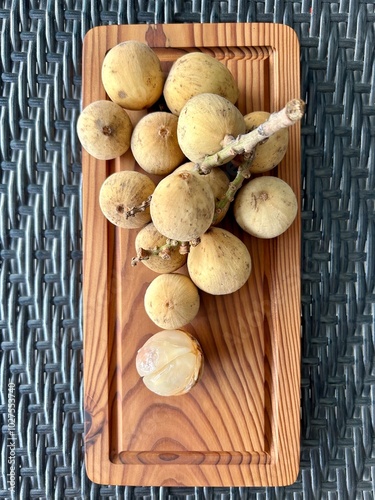 Dokong, duku or langsat fruits in southeast asia. Sweet fruit with translucent flesh. Lanzones fruit or scientific name Lansium Domesticum. photo