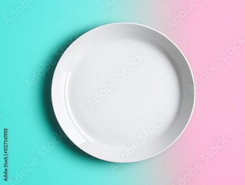 Aerial view of a blank ceramic plate on a soft gradient background, perfect for luxury and high-end product mockups photo