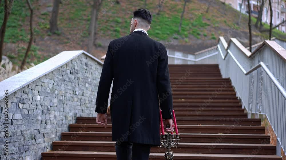 A figure in an enchanting dark coat with artistic makeup poses elegantly on outdoor steps, radiating charm A figure in an enchanting dark coat with artistic makeup poses elegantly on outdoor steps, radiating charm