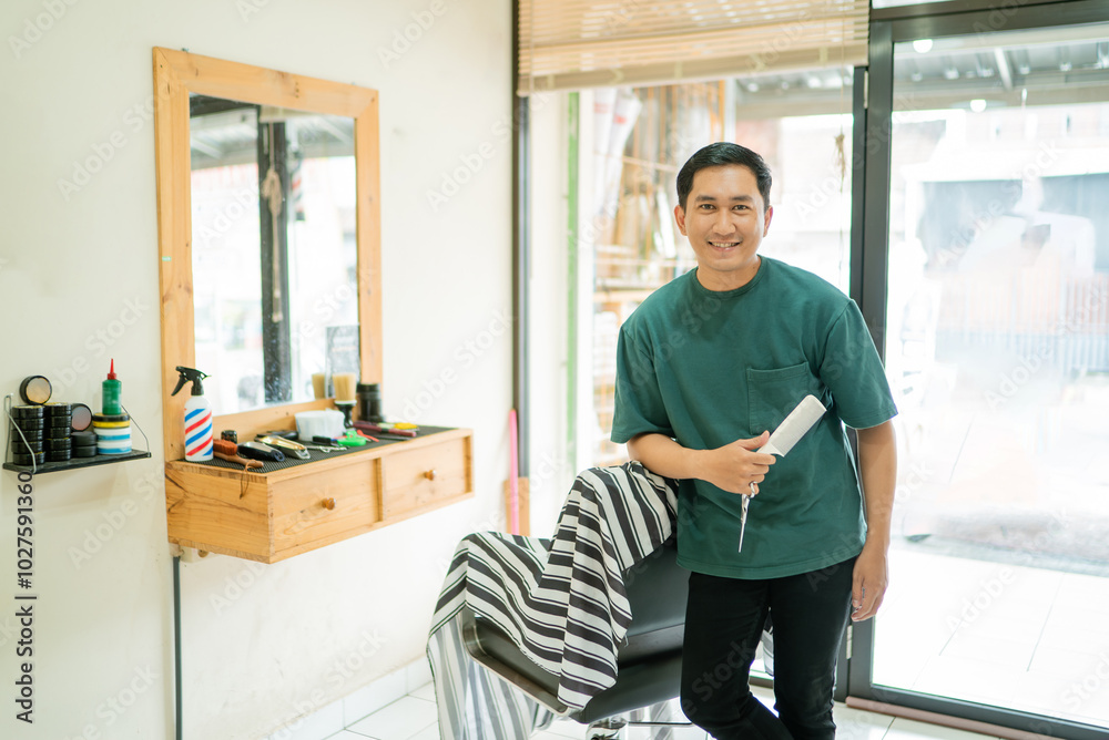 A man is currently standing inside a barber shop while holding a hair dryer in his hand, ready to use it for styling hair A man is currently standing inside a barber shop while holding a hair dryer in his hand, ready to use it for styling hair