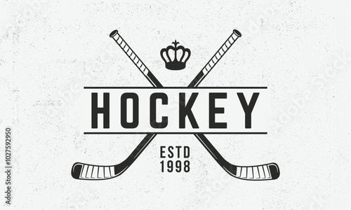 Ice Hockey logo. Vintage emblem with crossed hockey cues and royal Crown. Vector illustration