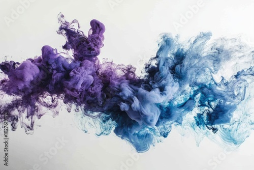 Vibrant ink splotches in various shades of blue and purple, creating an abstract cloud like effect photo