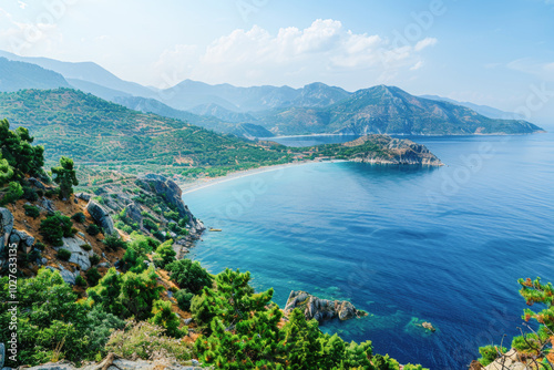 A breathtaking view of a clear blue coastal bay surrounded by rugged mountains, offering a peaceful and serene atmosphere.