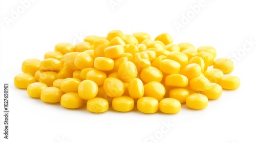 A pile of yellow, round candies isolated on a white background.