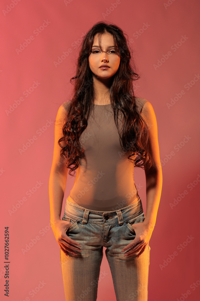 Young girl in red light, play of light and shadow