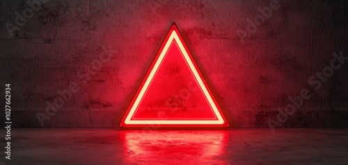 Red neon triangle sign glowing on textured background photo