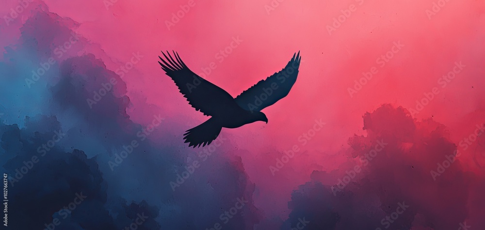 Fototapeta premium Silhouette of an eagle soaring against a vibrant, colorful sky.