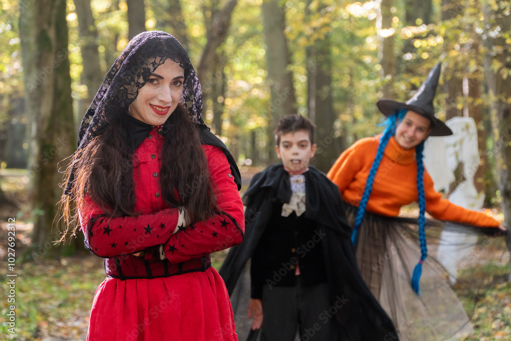 halloween in autumn forest, orange sweater, witch in striped stockings, teenager, boy dracula, red, funny witch, halloween, day of the dead holiday, dressed up witch halloween in autumn forest, orange sweater, witch in striped stockings, teenager, boy dracula, red, funny witch, halloween, day of the dead holiday, dressed up witch