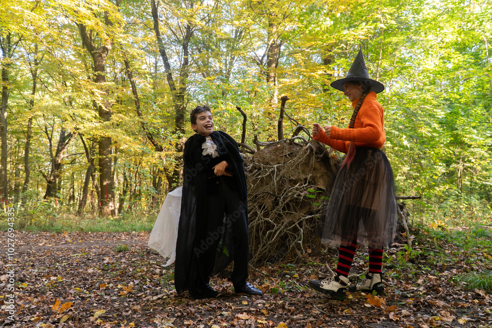 halloween in autumn forest, orange sweater, witch in striped stockings, teenager, boy dracula, red, funny witch, halloween, day of the dead holiday, dressed up witch halloween in autumn forest, orange sweater, witch in striped stockings, teenager, boy dracula, red, funny witch, halloween, day of the dead holiday, dressed up witch
