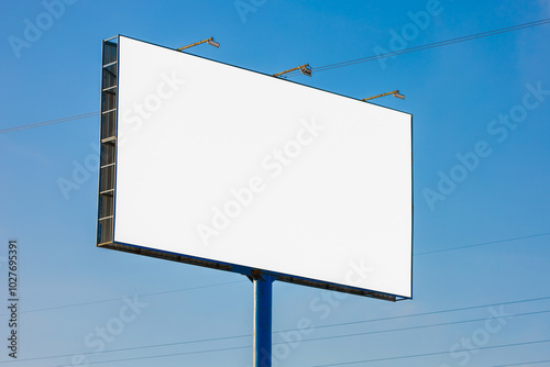 white billboard along the highway on a winter snow day. Background for design and advertising.  photo