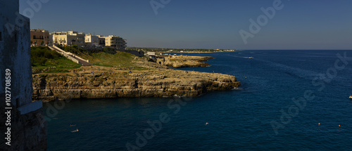 Coastline. Rocky shore with buildings in Polignano a Mare, Italy.