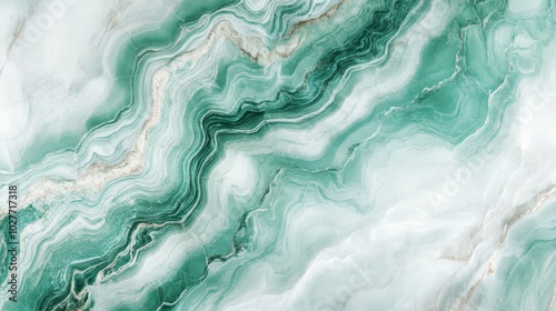 A marble texture with veins in an emerald green color. An abstract background with a natural stone design.