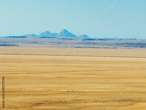 Desert landscape with the Spitzkoppe Mountains in the background, Khomas, Namibia photo