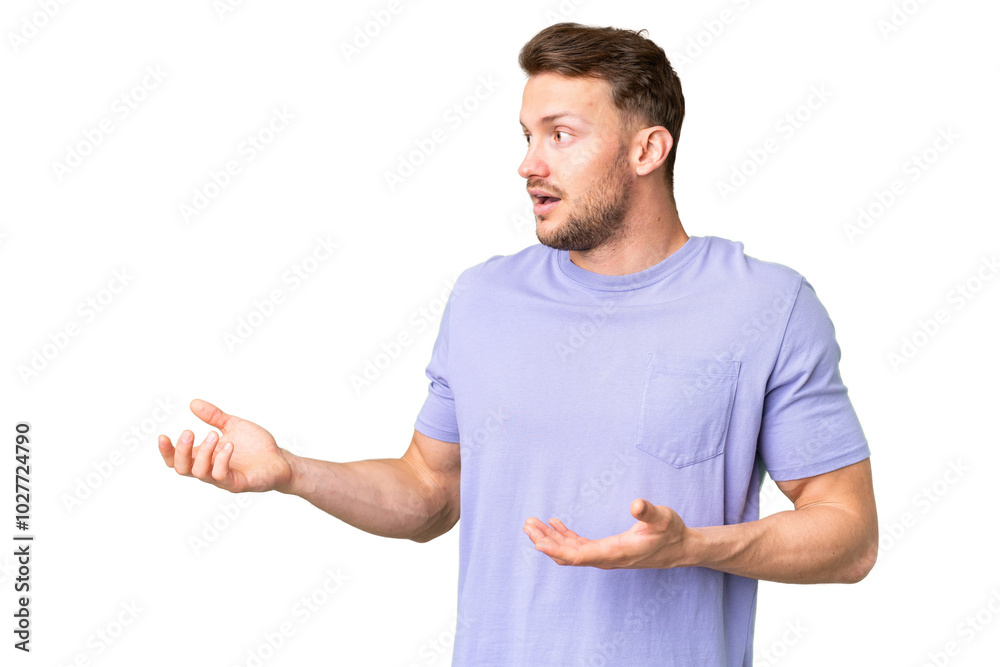 Young handsome caucasian man over isolated chroma key background with surprise expression while looking side Young handsome caucasian man over isolated chroma key background with surprise expression while looking side