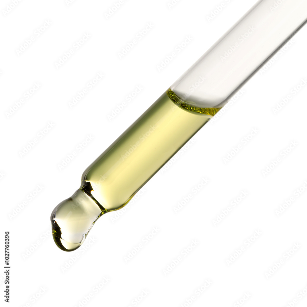Essential oil dripping from pipette against white background Essential oil dripping from pipette against white background