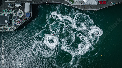 Aerial view of jet ski arount Brighton pier on a sunny summer day, East Sussex, UK photo