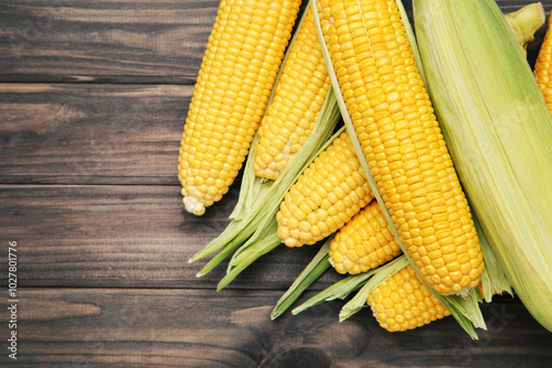 Sweet corn on wooden background