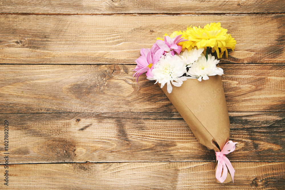 Bouquet of colorful chrysanthemums on wooden background with copy space. Concept teachers day