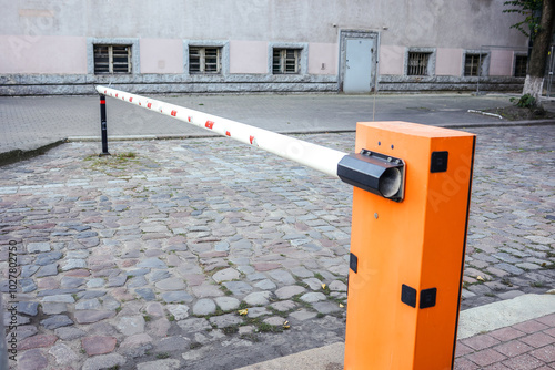 The barrier is red and white, the road is blocked, there is no passage. Closed passage, pass, permission to move on the road by transport, stop