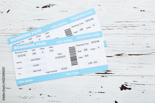 Obraz na płótnie Airline boarding passes on white wooden background w salonie