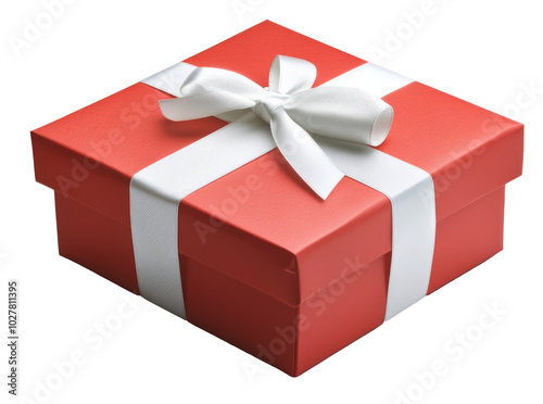 A vibrant red gift box with a white ribbon waiting to be opened on a festive ...