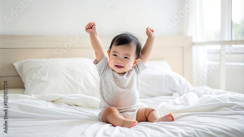 Little asian infant stretching happily on a clean white bed in the morning, morning, toddler, stretching, white bed, morning routine, serene, sleepy, baby, child, asian, panoramic