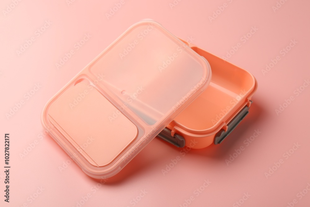 Empty plastic lunch box on pink background Empty plastic lunch box on pink background