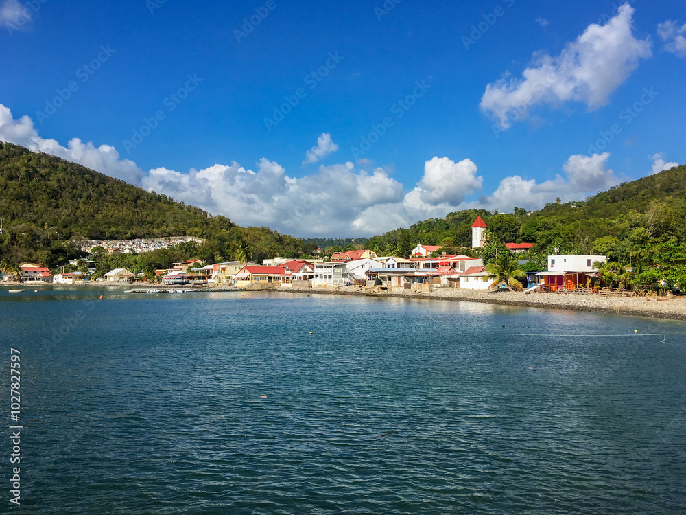 Obraz premium Deshaies waterfront under late afternoon sun, this quaint village is the main filming location of TV series 