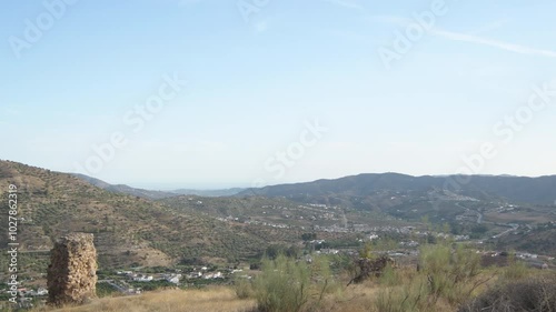 Rests of a ancient fortress at sunset, Alcaucin, Spain photo