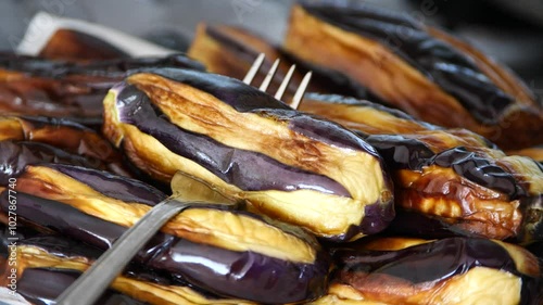 Eggplants cooked in oil were left to cool before placing them in the deep freezer.
