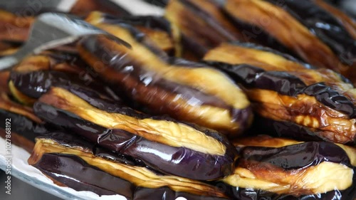 Eggplants cooked in oil were left to cool before placing them in the deep freezer.